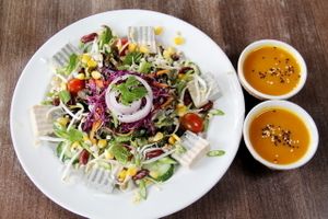 Salad with two portions of dressing (usually one is not enough and I usually have to ask for extra portion).  at Pun Pun Organic Vegetarian Restaurant - Wat Suan Dok in Chiang Mai