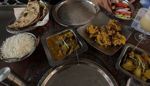 Two vegan curries, onion something for starter, little salad and Roti   at Mahek in Mahe