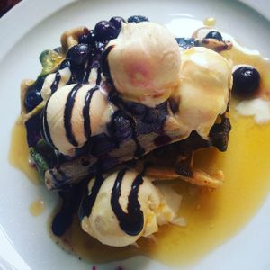 Matcha and chocolate waffles with ice cream, maple syrup and blueberries  at Eat Your Greens in Bristol