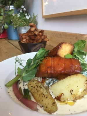 Roasted marinated carrot tofu with sautéed samphire & ruby chard, new potatoes, cream, white wine & garlic sauce 👌🏻 at Eat Your Greens in Bristol