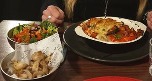Arrosto peppers filled with veg in a basil tomato sauce and baked with vegan cheese, served with spicy rice.
Sides of a mixed salad and garlic mushrooms  at The Fat Italian in Ormskirk