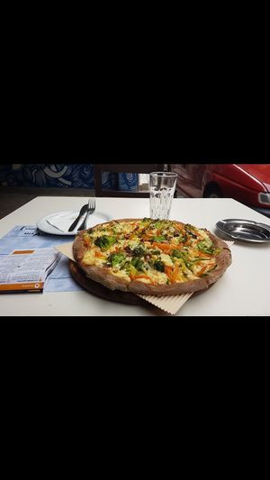 Delicious veggie pizza at Mystic Pizza - Exarchia in Athens