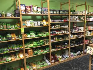 Selection of dried beans, pulses, fruits, seeds and grains at Cracked Wheat Organics in Welshpool