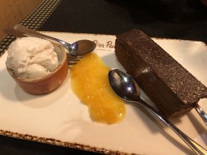 Chocolate mousse with coconut ice cream and apricot compote.  at Peter Pane in Vienna