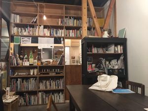 Cafe counter, lots of books to peruse while waiting for food at Lounge Kado in Okayama