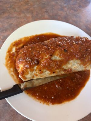 Burrito smothered in red salsa  at Baby Salsa Mexican Restaurant in Nanaimo