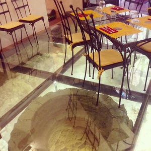 Etruscan Well and tables at Life Bistrot in Volterra