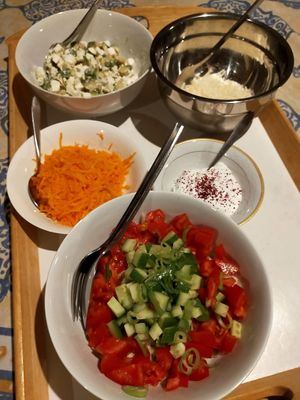 Side dishes for the black beans with vegetables. Feta with avocado, grated carrot, labanah, salad, grated cheese. at Petra Fig Tree Villa in Wadi Musa