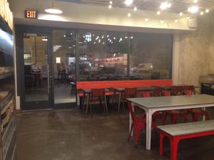 Inside seating. There is more seating opposite the checkout. at Shouk - Union Market in Washington