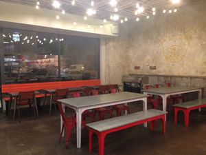 Inside seating. There is more seating opposite the checkout. at Shouk - Union Market in Washington