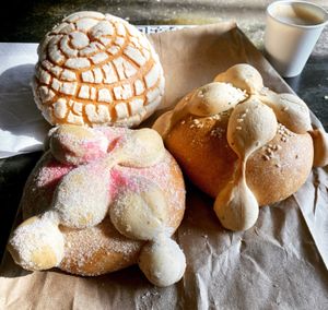 Vegan pan de muerto, vegan concha and cortado with oat milk   at Delicias Bakery in Los Angeles