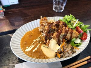 Delicious curry with extra cheese and katsu at Raku Robi Kitchen in Naha