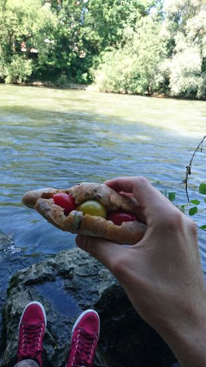 Breakfast with organic whole-grain bread with fresh vegetables bought from farmers market at the Mur riverside at Waldherr in Graz
