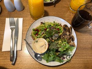 Avocado toast with hummus and mushrooms at Honey Cafe and Bakery in Kyiv