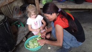 Tao and a little helper at Tao Guesthouse in Kasi