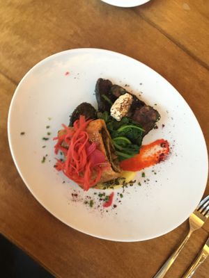 Eggplant dish with amazing house-made vegan cheese and spinach! at Cafe Mutin in Geneva