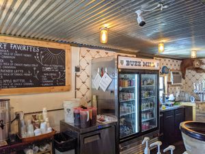 Hot and cold drinks and a restroom, surrounded by food trucks. at The Buzz Mill in Austin