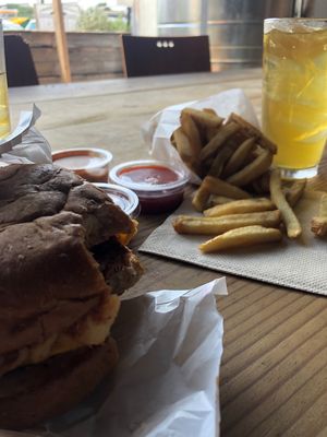 Campfire burger, fries, iced green tea  at The Buzz Mill in Austin