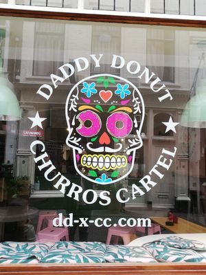 Logo on the window at Daddy Donut x Churros Cartel in The Hague