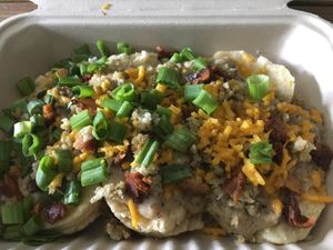 Biscuit and gravy with vegan bacon  at Biscuits + Groovy - Food Trailer Barton Springs in Austin