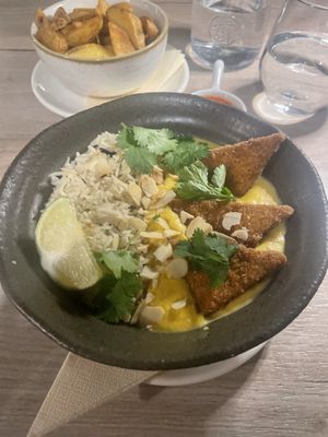 Saffron sauce and pilau rice (I requested it with tofu instead of cauliflower) wedges and tomato sauce  at Manna 68 in Gdansk