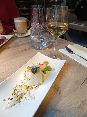 Pistachio Panna Cotta with white chocolate sauce and home white wine #Veganuary at Manna 68 in Gdansk