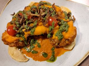 Cauliflower steak with oyster mushrooms and tomato sauce, apples and pesto at Manna 68 in Gdansk