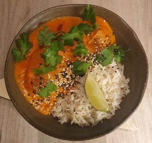Indian vegetable koftas with tofu and plums in a velvety fenugreek sauce, served with GF pulao rice at Manna 68 in Gdansk