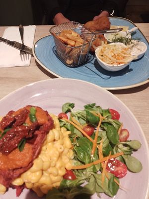 Cauliflower waffles with mac & cheese, and fish & chips. at Manna 68 in Gdansk