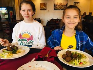 Happy kids with falafel platters! at Al Rayan Restaurant & Market in Murfreesboro