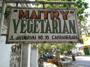 Street sign for the restaurant at Maitry in 