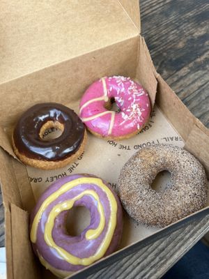Tasting box: Chocolate to replace the Miso Honey; Rick Martinez (pink one); Chaga Chai, and Purple Haze...  at Holey Grail Donuts - Food Truck in Hanalei
