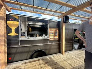 Covered area in front of the truck is a great place to gobble those donuts immediately    at Holey Grail Donuts - Food Truck in Hanalei