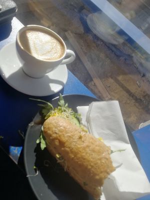 Hummus sandwich and cappuccino with oat milk at Przystan in Szczecin
