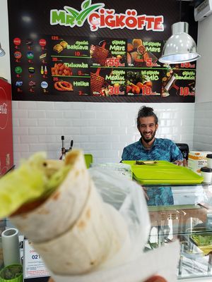 Menu and happy owner at Mr. CigKofte in Bucharest