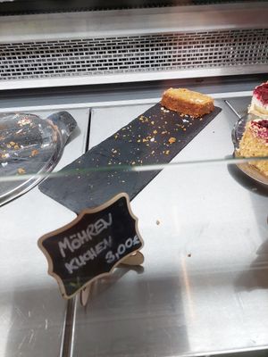 Vegan carrot cake (3€) - piece looks weird because it has fallen over, there's also icing at Naturium in Egestorf