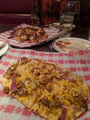Ballpark pizza in foreground and Neapolitan in background at Guido's Pizza in Billings
