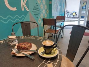 Flat white & vegan chocolate flapjack at Baba Ganoush in Kendal