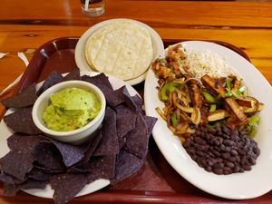 Delicious tofu fajitas and chips with guacamole! Addicting! at A Moveable Feast Restauarant & Store in Houston