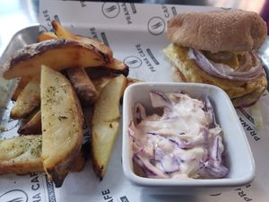 Chickn burger with wedges and coleslaw at Prana Cafe in Leicester
