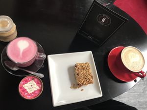 Almond milk beetroot latte, books booja ice cream, oat milk latte and flapjack at Prana Cafe in Leicester