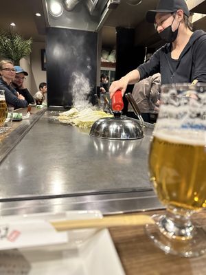 Okonomiyakis being prepared  at Kamehameha - かめはめは in Kyoto