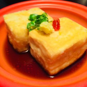 Fresh tofu, floured & fried, swimming in a soy broth, topped with ginger & a touch of spicy sambal.  at D'Vine Restaurant & Lounge in Nikko