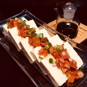 Fresh, chilled tofu topped with a splash of soy sauce and spicy, Korean kimchi. at D'Vine Restaurant & Lounge in Nikko