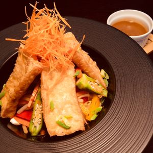Lightly curried,  stir-fried seasonal vegetables with lightly floured, fried tofu steaks. Served on a bed of rice with a generous side of our piquant peanut sauce. at D'Vine Restaurant & Lounge in Nikko