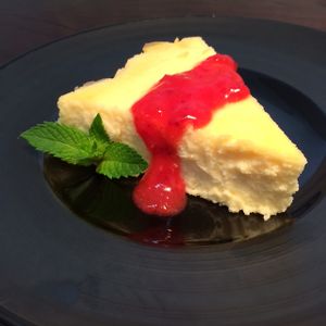 By replacing the sour cream with yoghurt, you get all the moist & creamy density of New York Cheesecake without the guilt-ridden calories. Drizzled in strawberry coulis.  at D'Vine Restaurant & Lounge in Nikko