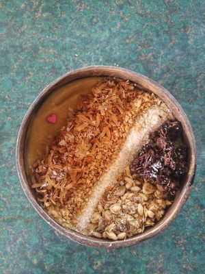 Tropical Smoothiebowl with granola, roasted coconutflakes and peanuts   at Indiana vegan Cafe & Yoga in Langkawi
