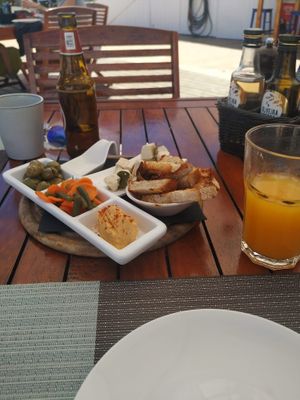 Appetizers: Olives, humus, green beans and carrots, and marinated tofu at Terra Restaurant in Sagres