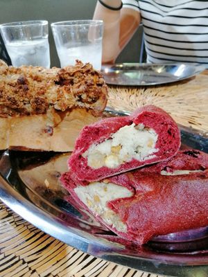 Rice bread (back) and vegan cheese filled bread with fruits nuts and chickpeas at Milhanjum 밀한줌 - Jungang Station in Busan