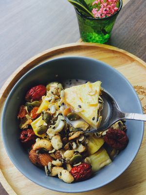 Homemade granola with seasonal mixed fruit and rice milk at Everflow in Koh Chang